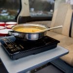 pot of soup on gas hob in toyota campervan