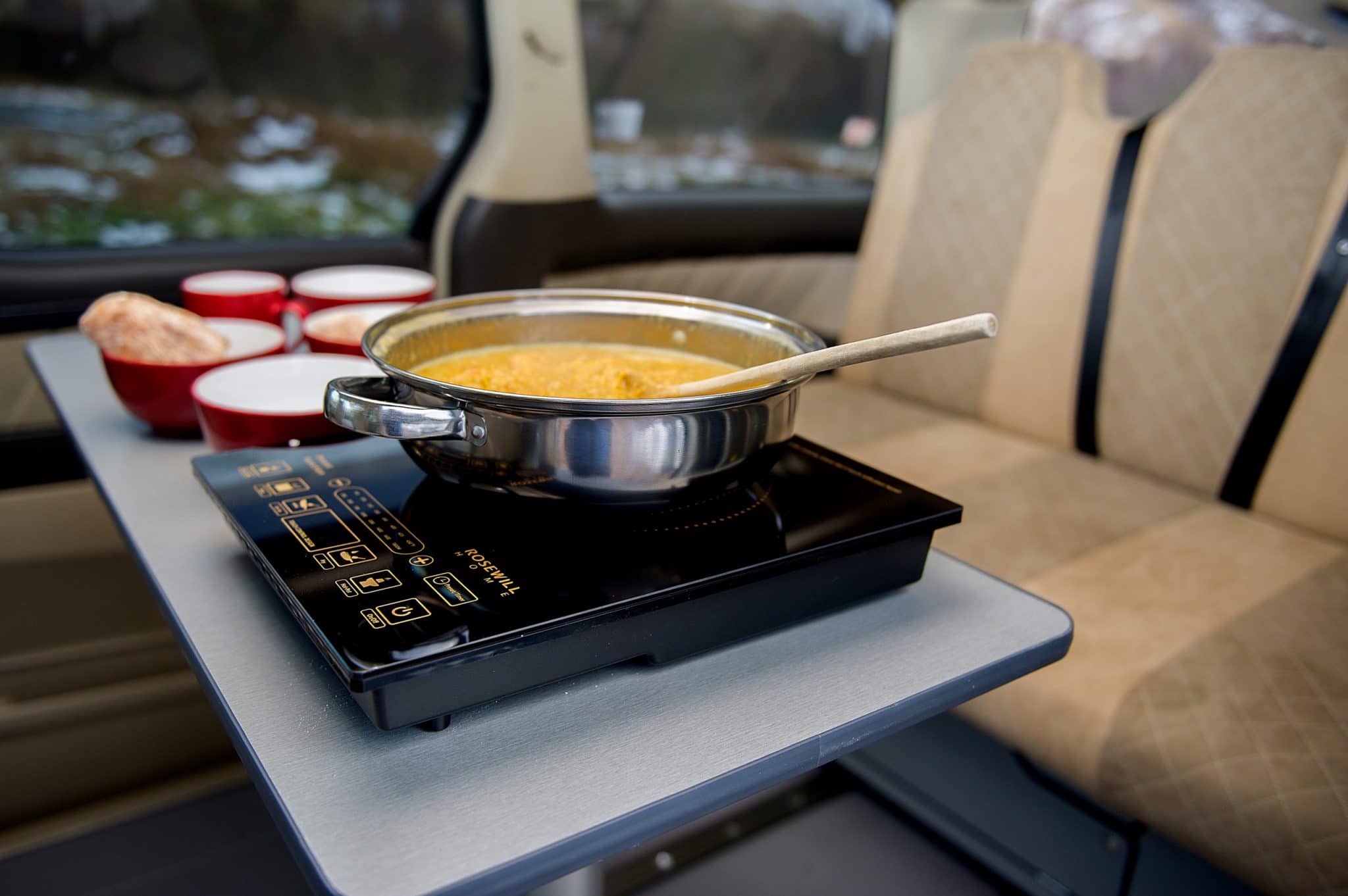 pot of soup on gas hob in toyota campervan