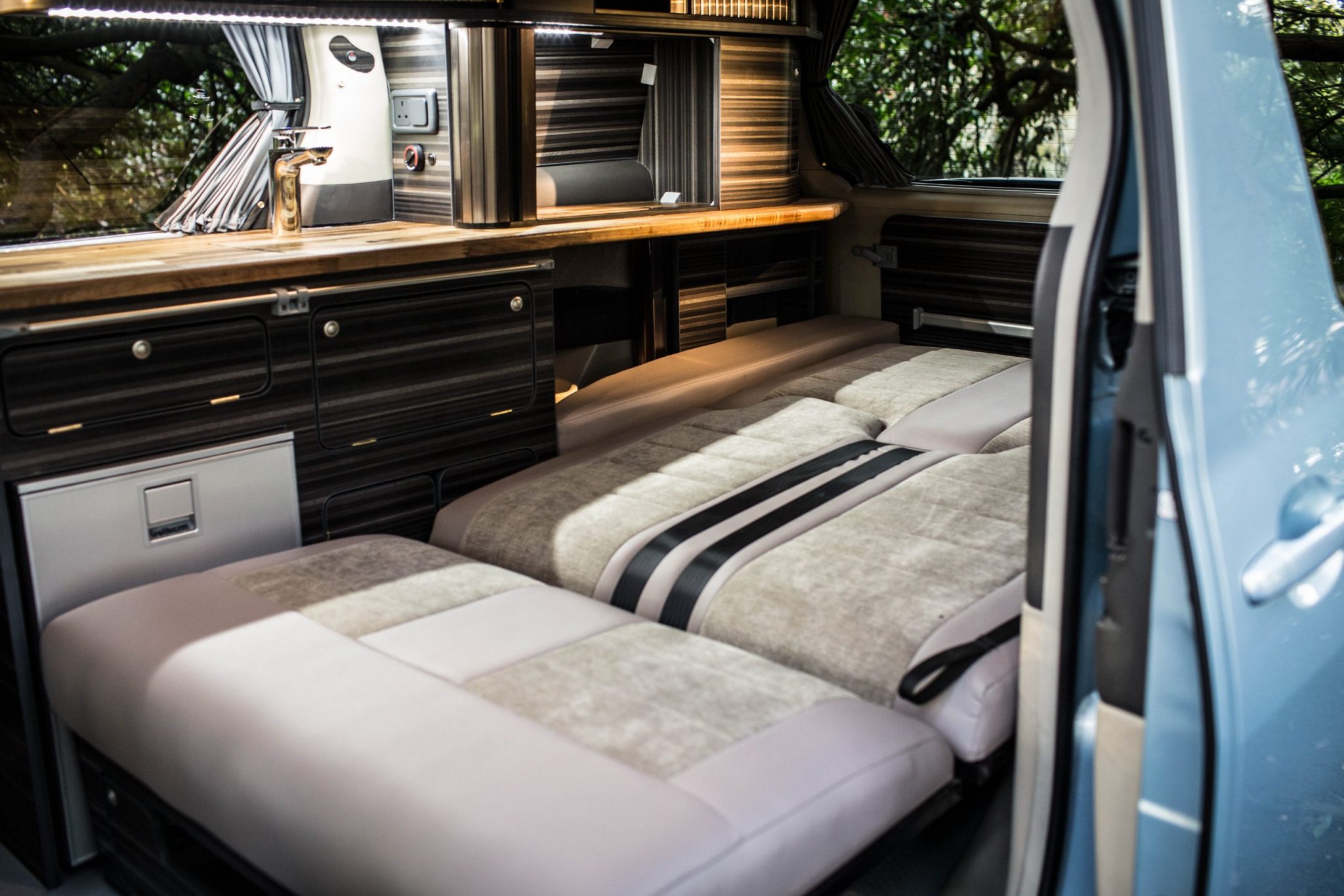bed inside a toyota alphard hybrid eco campervan for sale