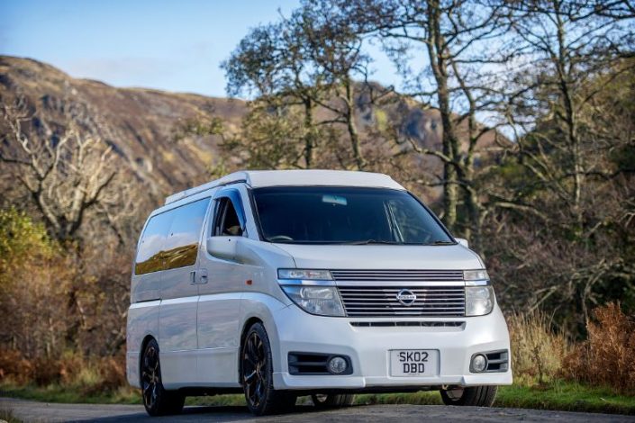 Nissan Elgrand in white with scenic backdrop