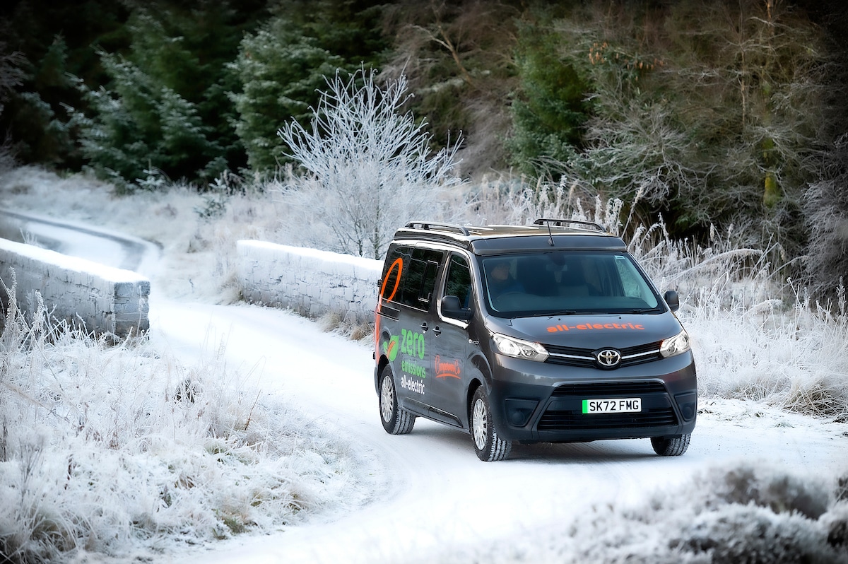 Electric Toyota Proace Campervan Conversion for Sale in the UK driving in snowy countryside