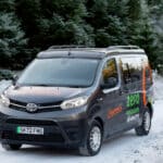 Electric Toyota Proace Campervan Conversion for Sale in the UK driving in snowy forrest