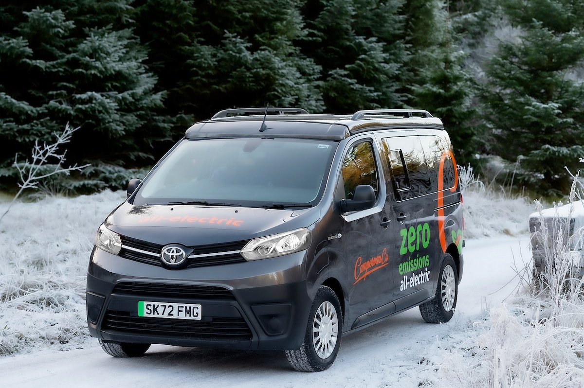 Electric Toyota Proace Campervan Conversion for Sale in the UK driving in snowy forrest