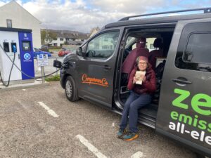 Electric Campervan charging while enjoying a cuppa