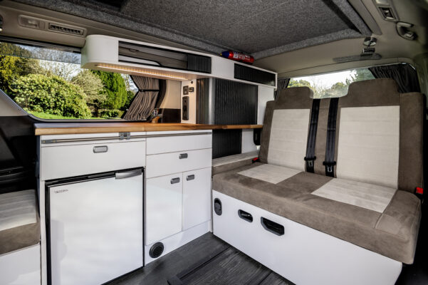 Wide angle view from side door of the luxurious interior of the Toyota Alphard Connect II Campervan