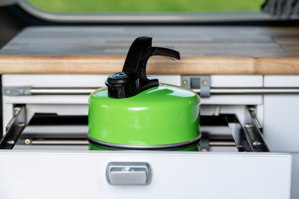 Green kettle powered by 2000w induction hob in Toyota Alphard Connect II Campervan