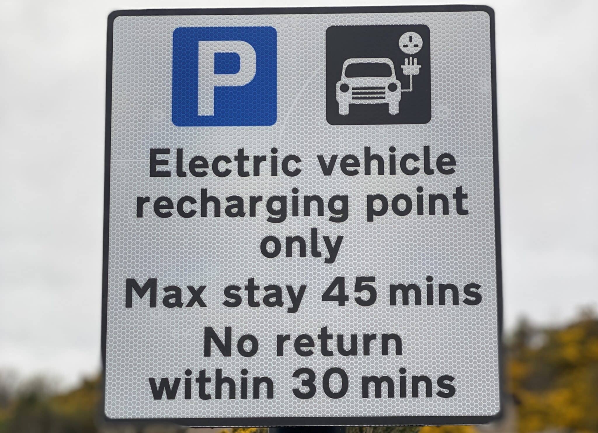 EV charging point sign with time limit