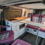 Fully electric, zero-emissions Eco Revolution 7 seater campervan interior with blinds down
