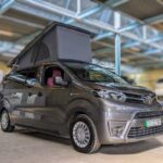 Fully electric, zero-emissions Eco Revolution 7 seater campervan grey parked in cool workshop