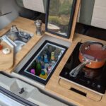 Toyota Hybrid Eco Escape Rear Kitchen Pod cooking with fridge open