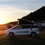 Toyota Hybrid Eco Escape with roof up on beach sunset