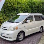 Toyota Alphard Hybrid Eco Explorer ZME white living area with roof down