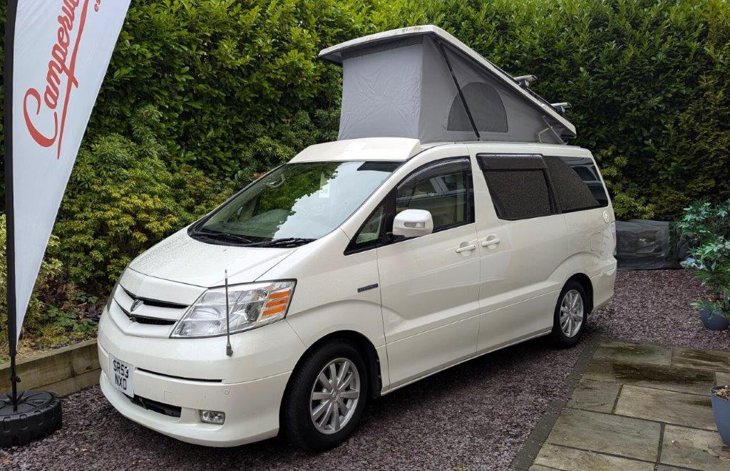 Toyota Hybrid Eco Pioneer white nxo with roof up